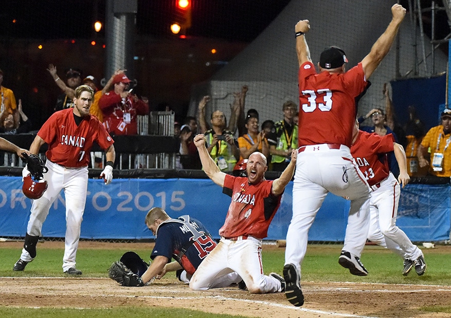 Peter Orr of team Canada scores the winning run to defeat the USA as part of the Pan Am Games