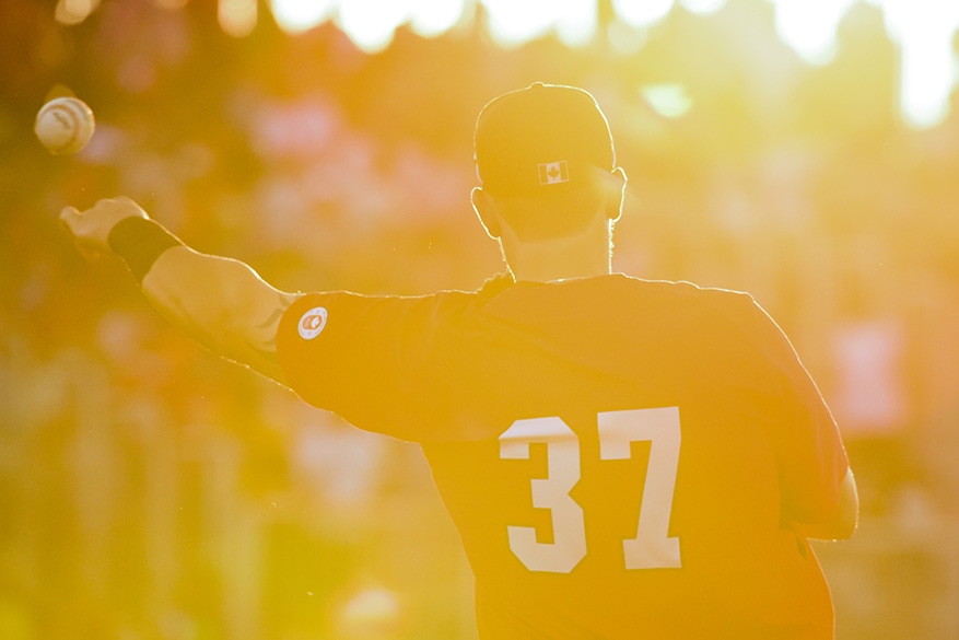 Canadian first basemen Jordan Lennerton warms up between innings during the gold medal game against the United States. Canada defeated the USA 7-6 in extra innings at President’s Choice Ajax Pan Am Ballpark as part of the Pan Am Games.