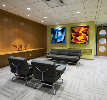 Interior of a luxury Toronto hotel lobby with modern designer furniture, paintings, and creative architecture