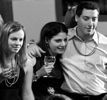 Family members surround a young man during his bar mitzvah celebrations