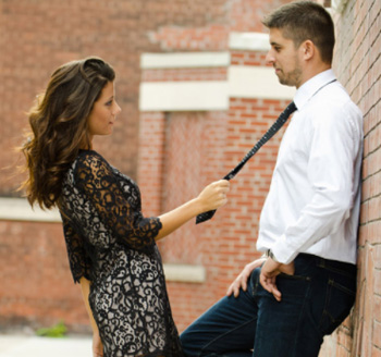 Beautiful woman poses with her fiance for an engagement photo