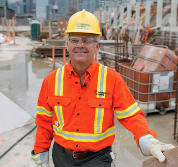 Toronto Hydro employee stands at a work site for a corporate promotional photo