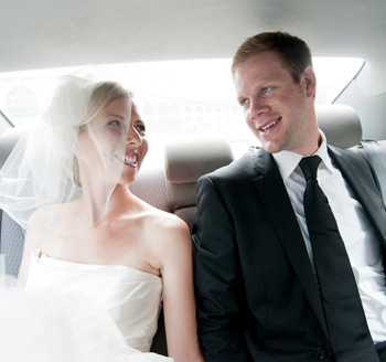 Couple just married and sitting in limousine