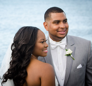 Bride and groom pose for a wedding photo