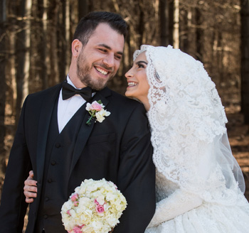 Happy married couple pose for their wedding photo