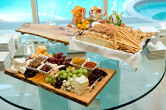Photo of cheeses, fruits, and breads for a corporate event